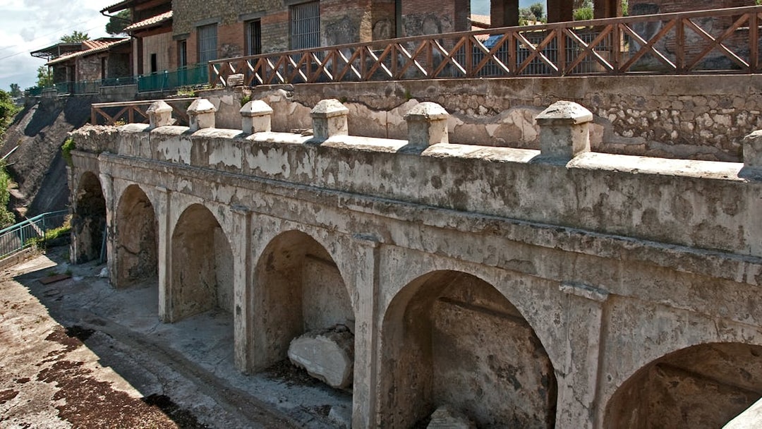 Villa Arianna Pompeii ancient arches and stone structure.