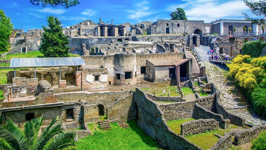 Ancient ruins of Pompeii with stone houses and streets in Naples, Italy.