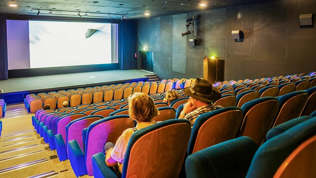 Cinema seating at Pont du Gard museum, showcasing a film experience.