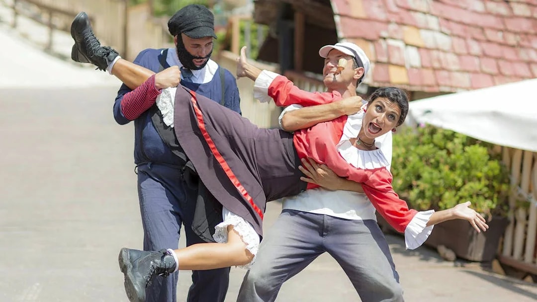 Popeye crew performing a playful scene at Popeye Village, Malta.