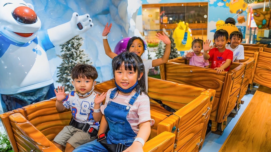 Children enjoying a ride at Pororo Park Singapore.