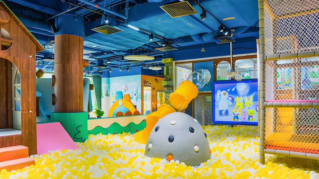 Indoor playground with slides and ball pit at Pororo Park Singapore.