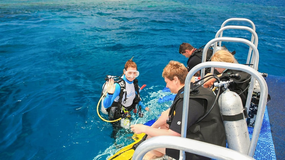 Snorkelers preparing to dive from a boat near Low Isles Island, Port Douglas.
