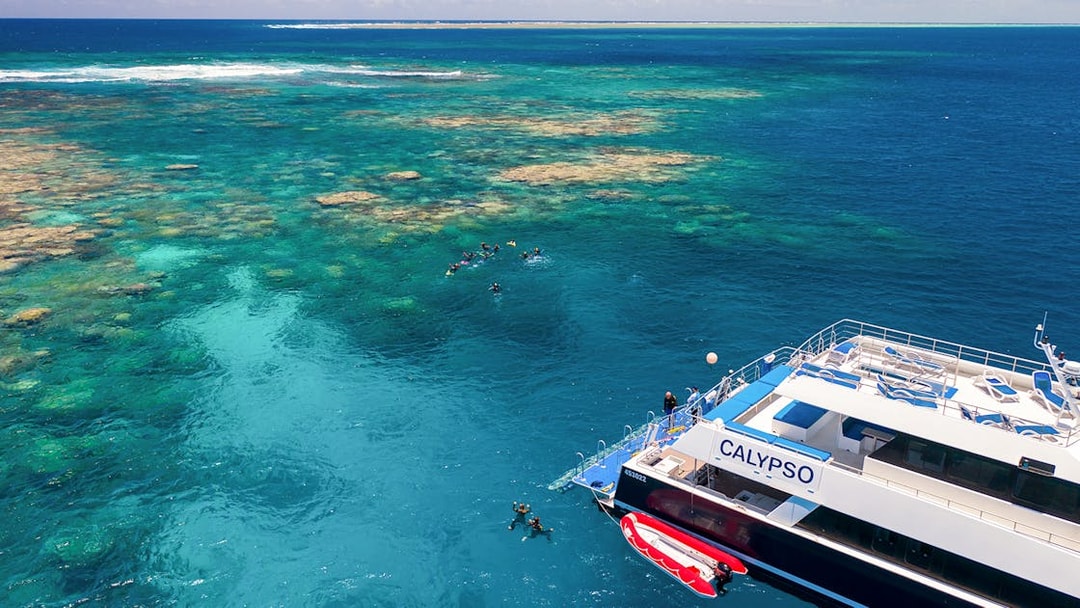Cruise ship near snorkelers on the Outer Great Barrier Reef.