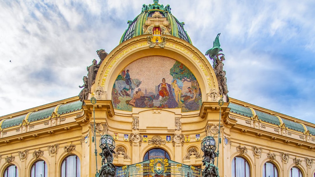 Municipal House facade with mosaic in Prague's Old Town.