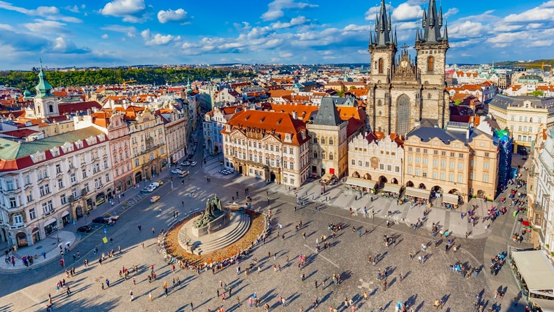 Aerial view of Prague's Old Town Square with Tyn Church and Jan Hus monument.