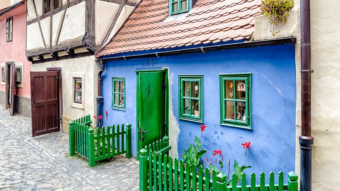 Blue house with green door and windows on Golden Lane, Prague.