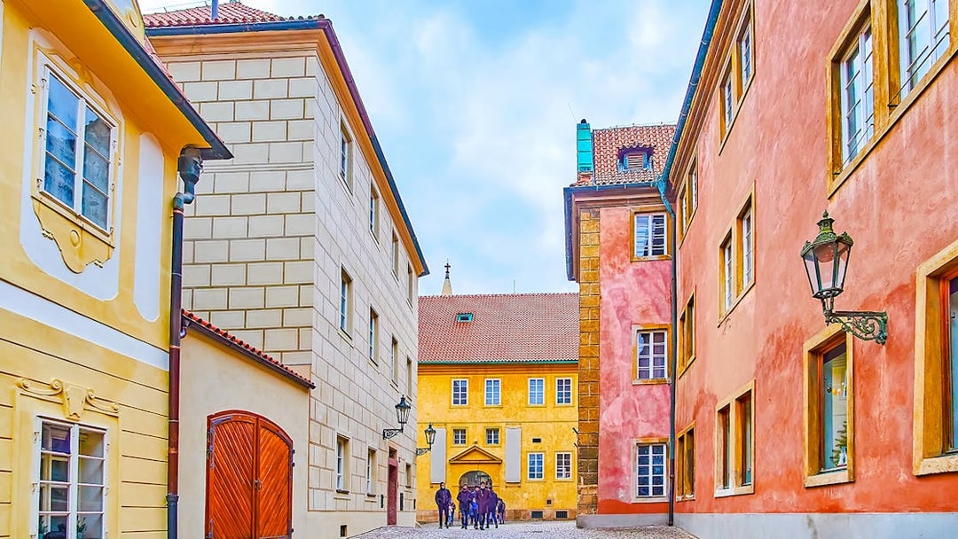 Colourful houses on Golden Lane in Prague with cobblestone street.