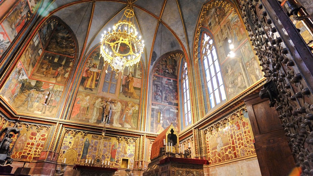 St Wenceslas Chapel interior with ornate frescoes and chandelier, Saint Vitus Cathedral, Prague.