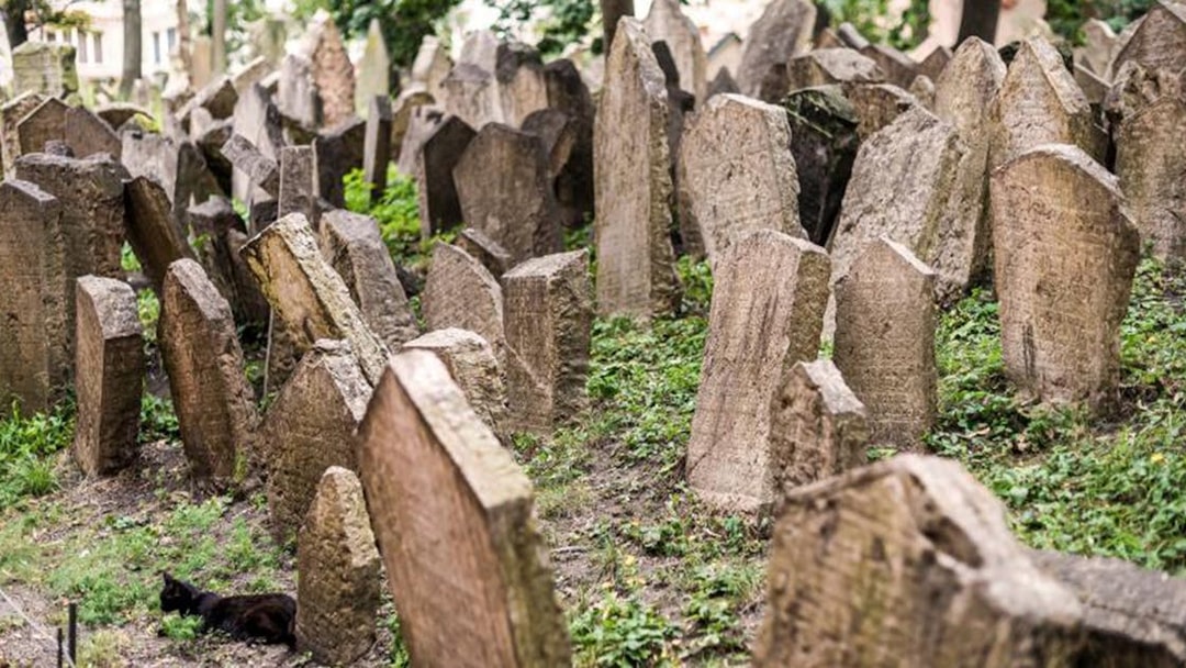 Old Jewish Cemetery in Prague with ancient tombstones.