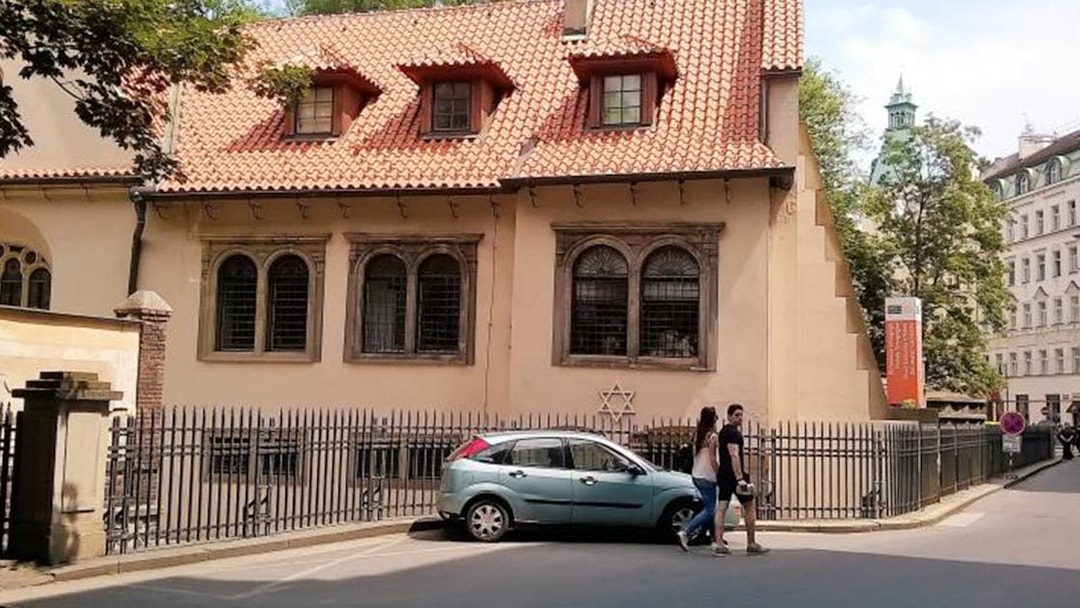 Prague Jewish Quarter, historic building with Star of David, part of 2.5-hour tour.