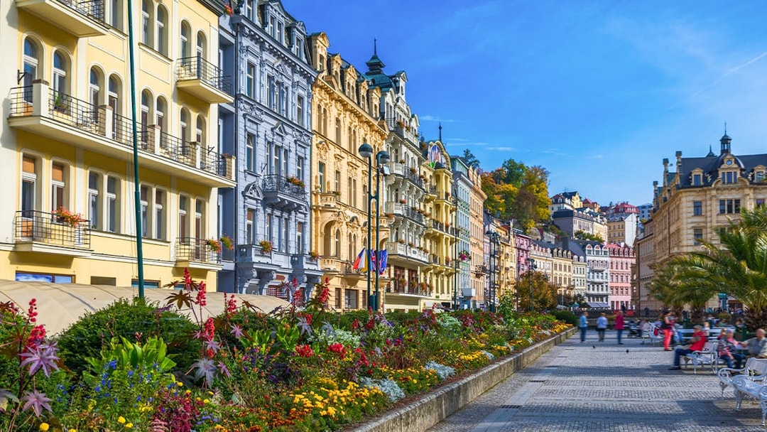 Colorful historic buildings and gardens in Karlovy Vary, Czech Republic, on a day trip from Prague.
