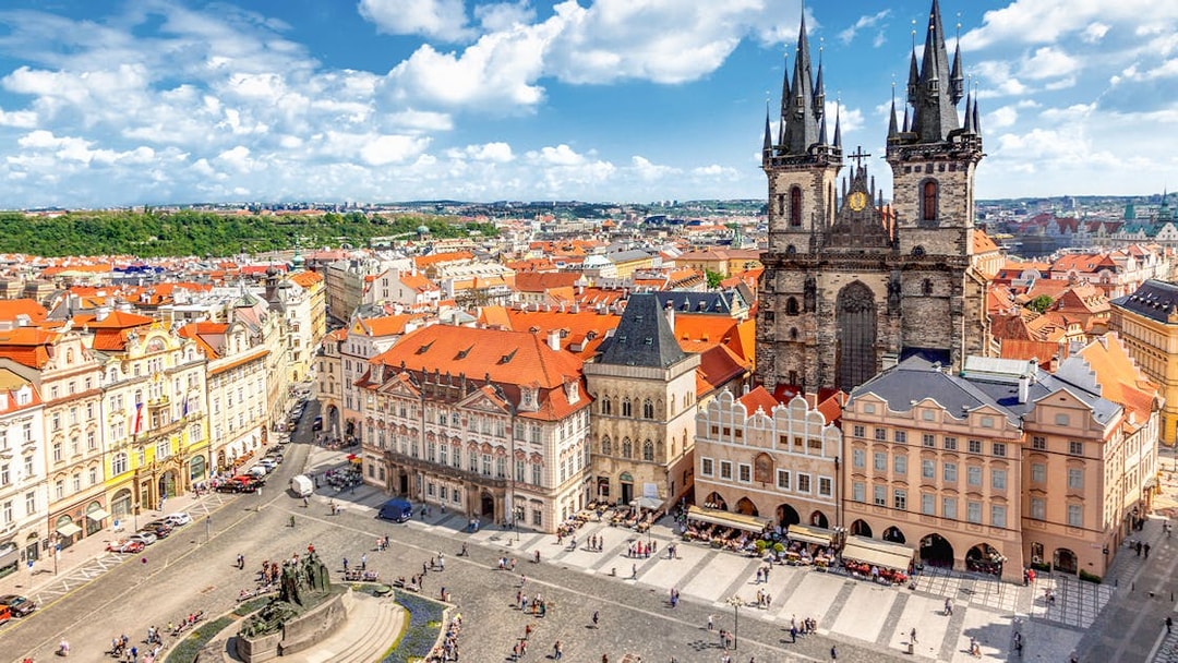 Prague Castle tour group exploring historic architecture in Old Town Square.