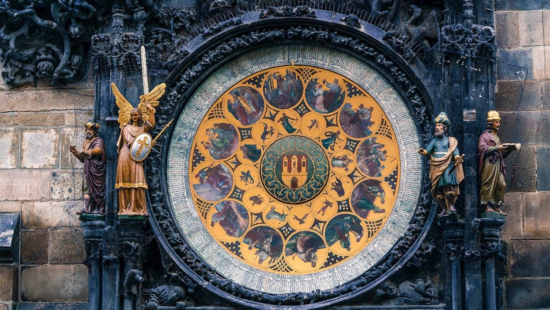 Prague Astronomical Clock with detailed zodiac signs and statues.