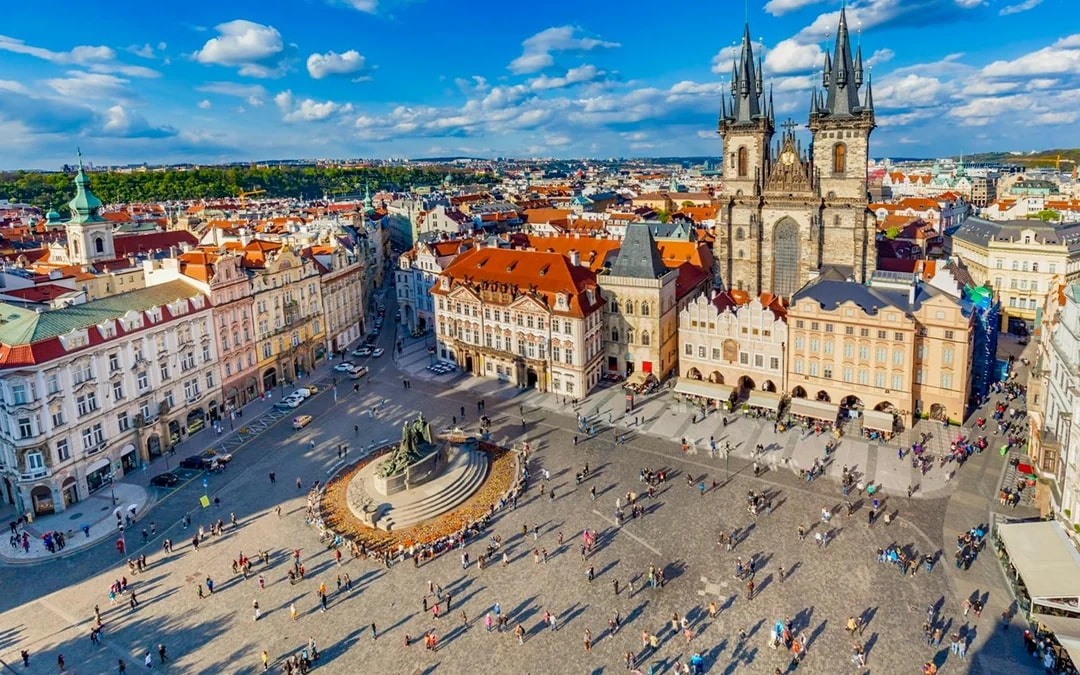 Aerial view of Prague's Old Town Square with Tyn Church and Jan Hus monument.
