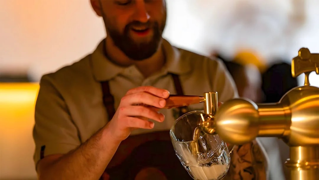 Bartender pouring Pilsner Urquell during Tapster training session.