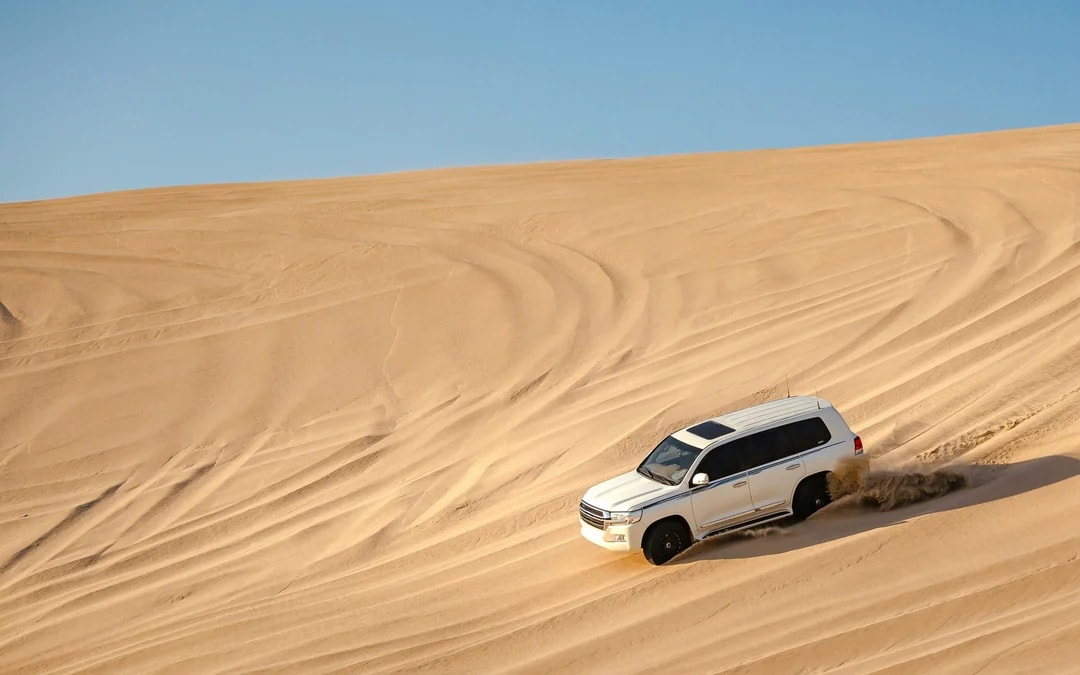 Premium Doha Desert Safari with Dune Bashing, Sandboarding, Camel Ride, Quad Biking & Inland Sea Image 6
