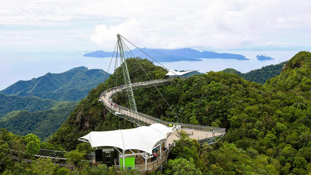 Langkawi Skybridge spanning lush forests with distant islands in view.