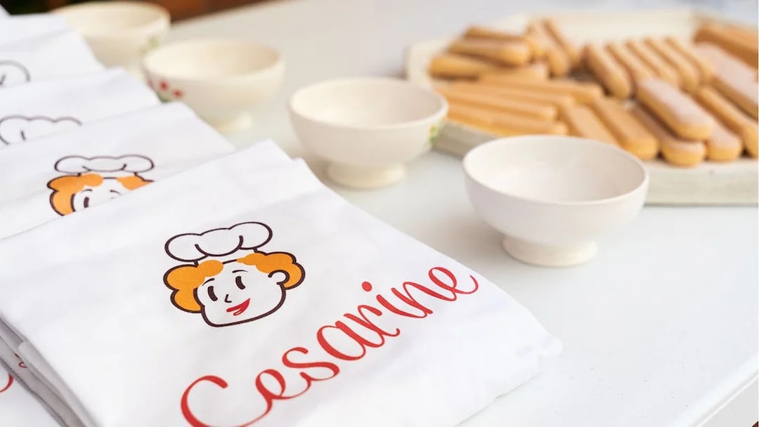 Aprons and bowls set up for a private cooking class in Milan.
