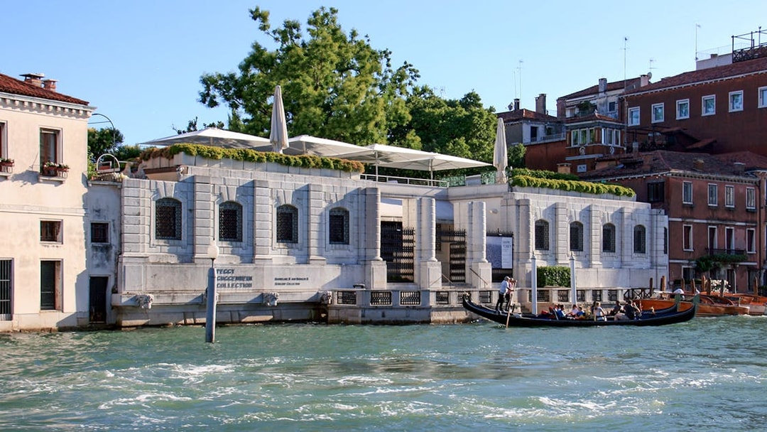 Gondola ride past Peggy Guggenheim Collection in Venice, Italy.