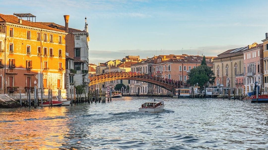 Grand Canal at sunset with Ponte dell'Accademia bridge in Venice.