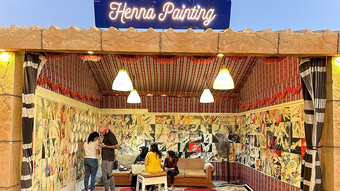 Henna painting booth during private desert safari experience.