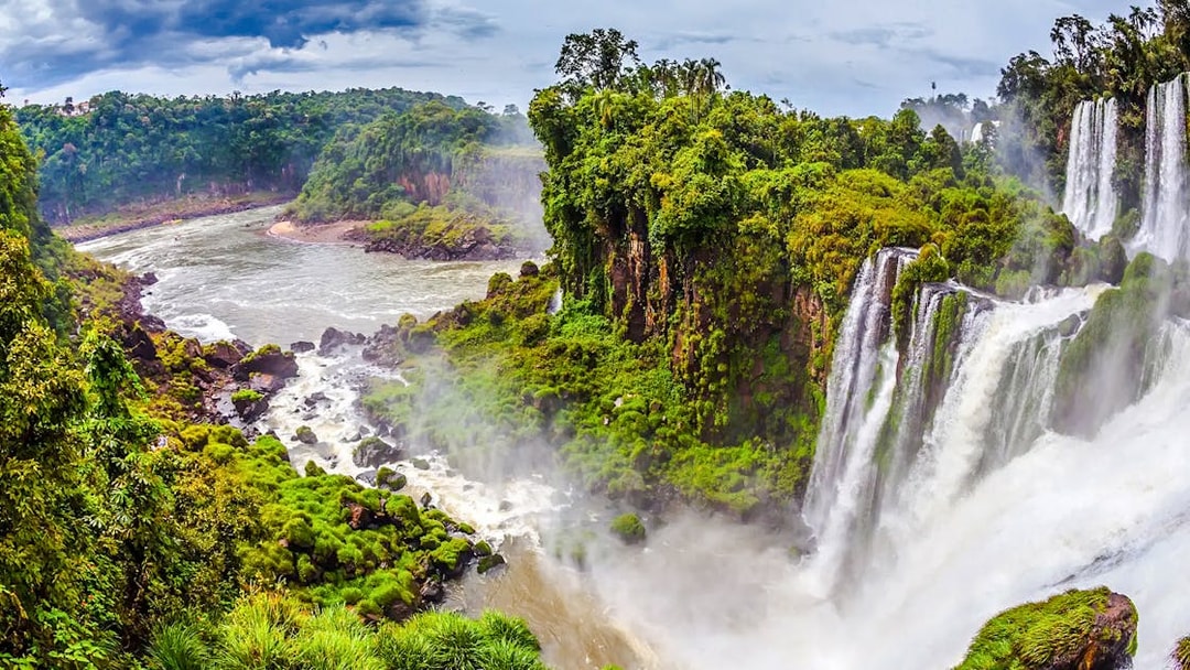 Argentine Falls with lush greenery and cascading water.
