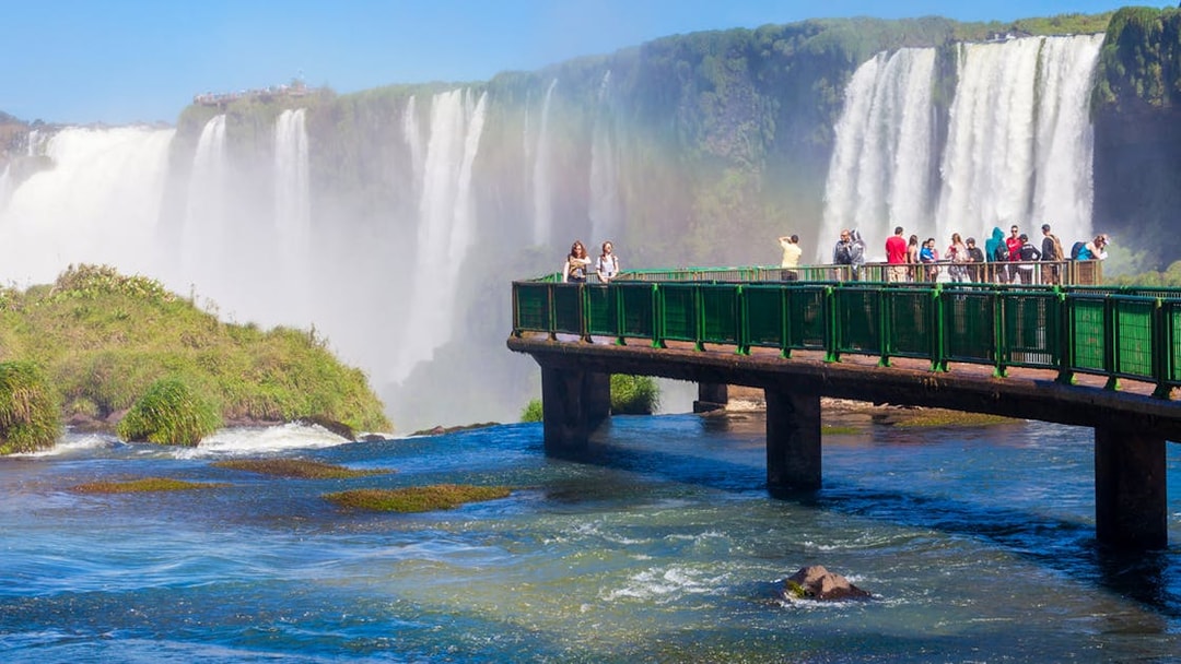 Visitors on a walkway overlooking Iguazu Falls, Argentina.