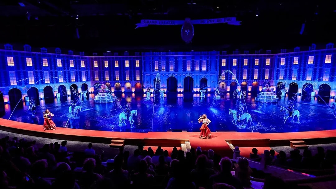Grand Théâtre show with performers and horses at Puy du Fou, France.