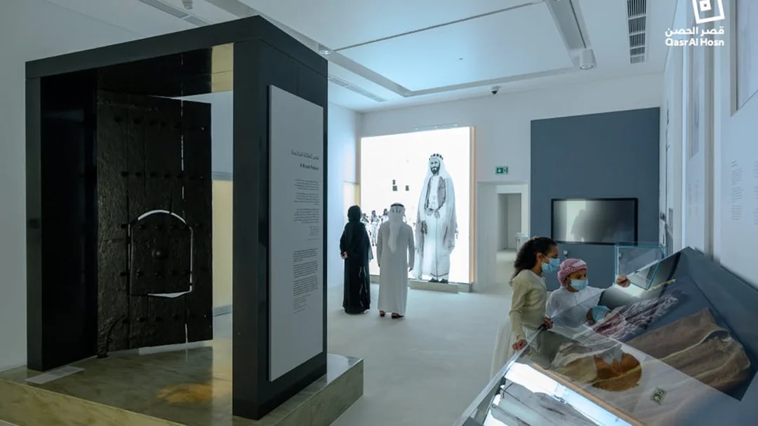 Visitors exploring exhibits at Qasr Al Hosn museum in Abu Dhabi.