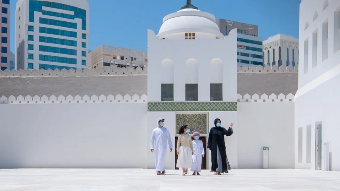 Visitors exploring Qasr Al Hosn courtyard in Abu Dhabi.