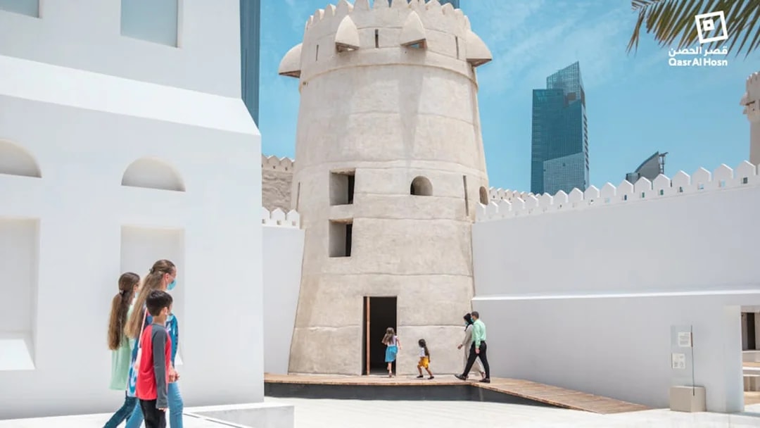 Visitors exploring Qasr Al Hosn fort in Abu Dhabi.