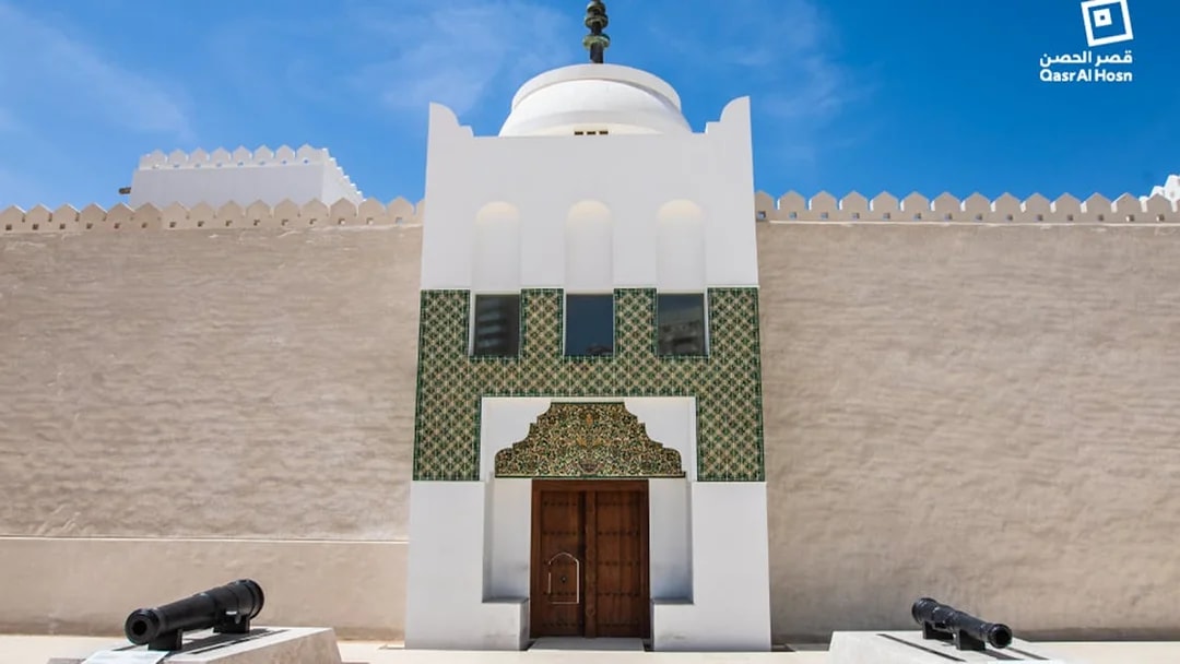Qasr Al Hosn entrance with traditional architecture and cannons, Abu Dhabi.