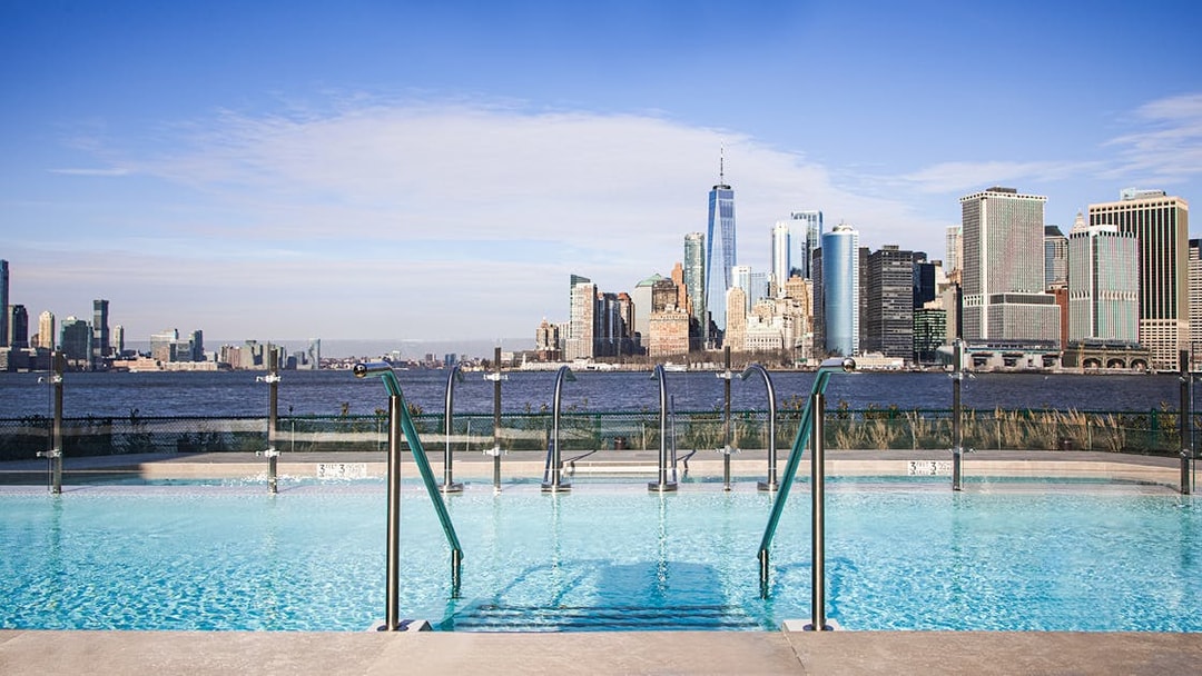 Rooftop pool with New York City skyline view, QC New York.