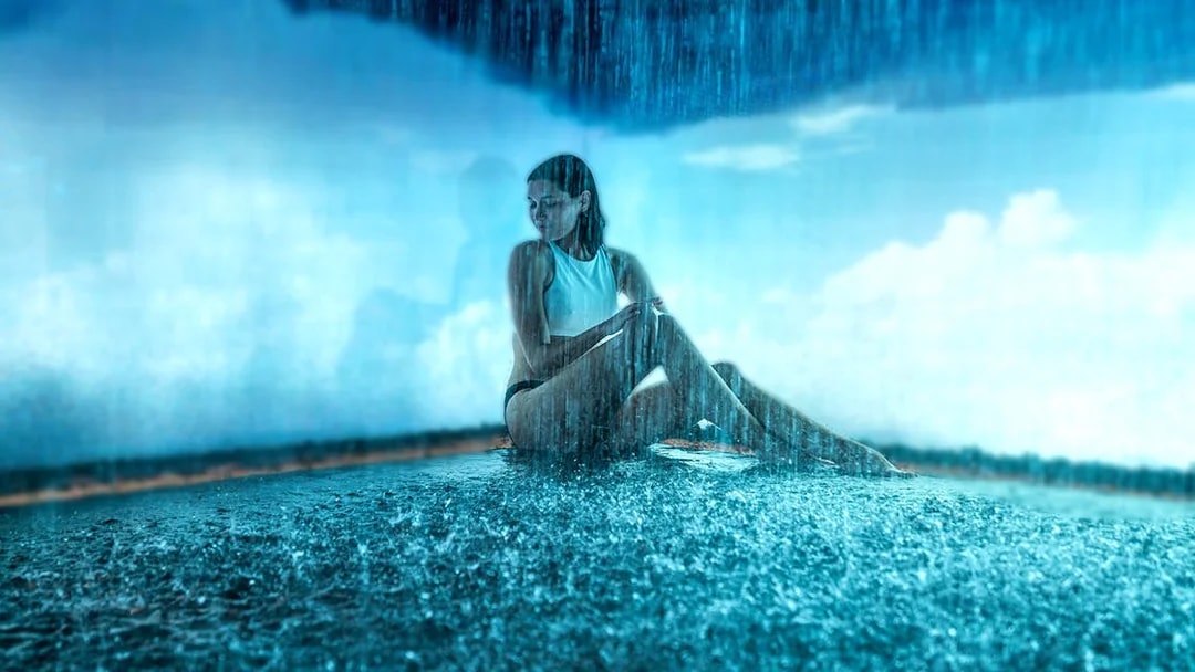 Visitor enjoying a rain shower at QC Terme Milano Resort & Spa.