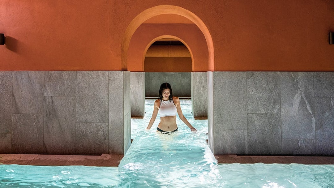 Visitor enjoying the pool at QC Terme Milano Resort & Spa.