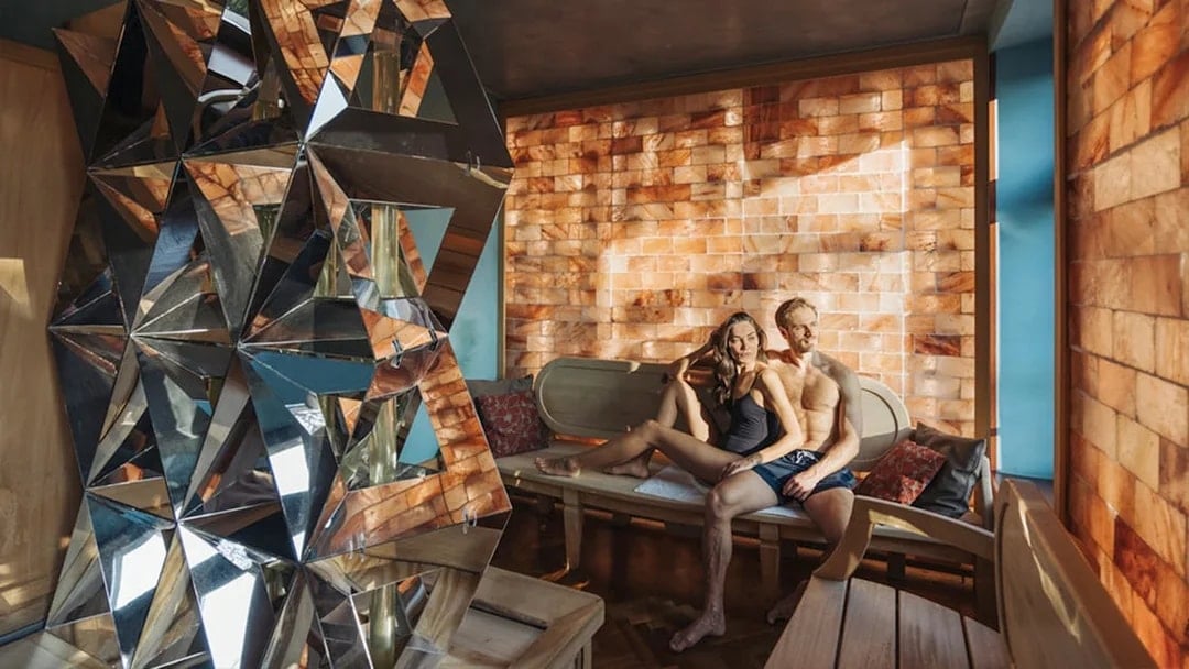 Visitors relaxing in a salt room at QC TermeTorino Spa, Italy.