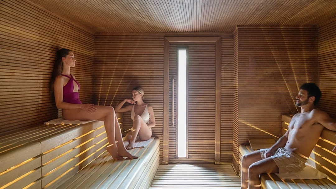 Visitors relaxing in the sauna at QC TermeTorino Spa, Italy.
