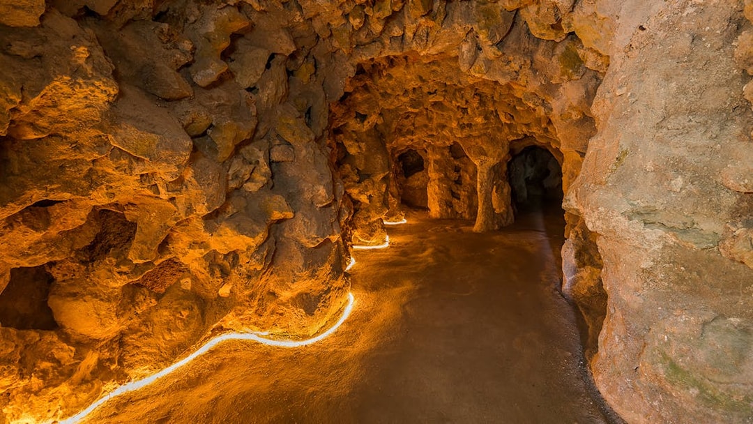 Underground tunnel with stone walls at Quinta da Regaleira, Lisbon.