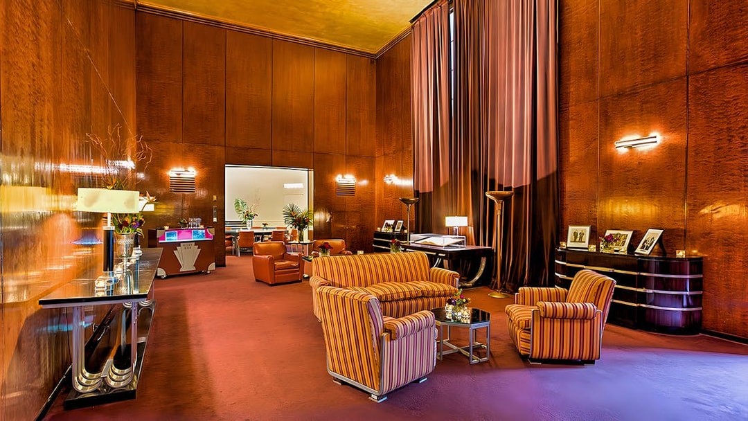 Radio City Music Hall lounge with art deco furniture and decor.