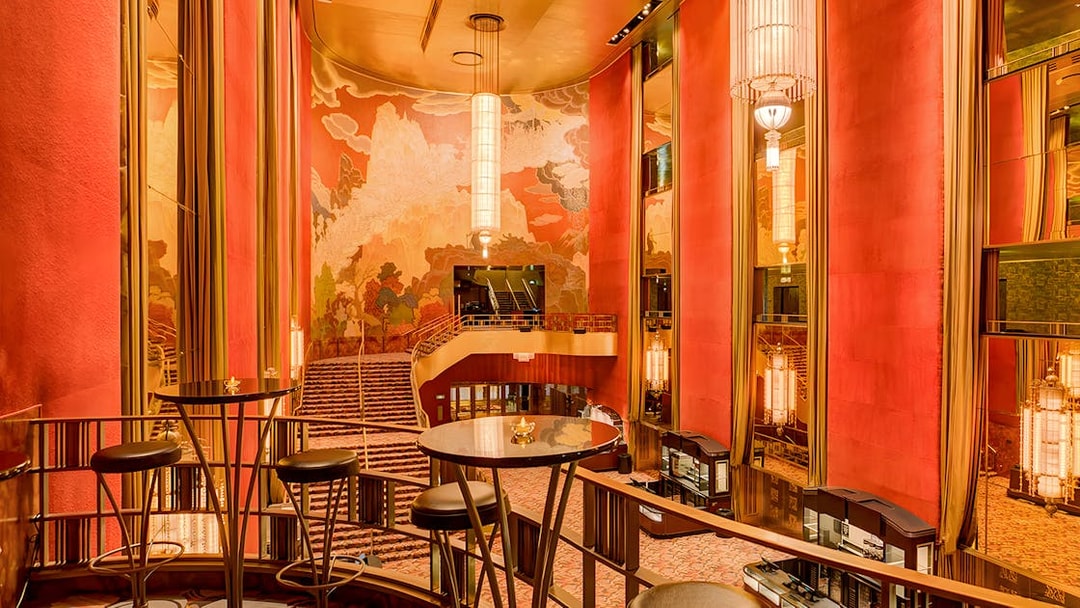 Radio City Music Hall interior with art deco design and grand staircase.