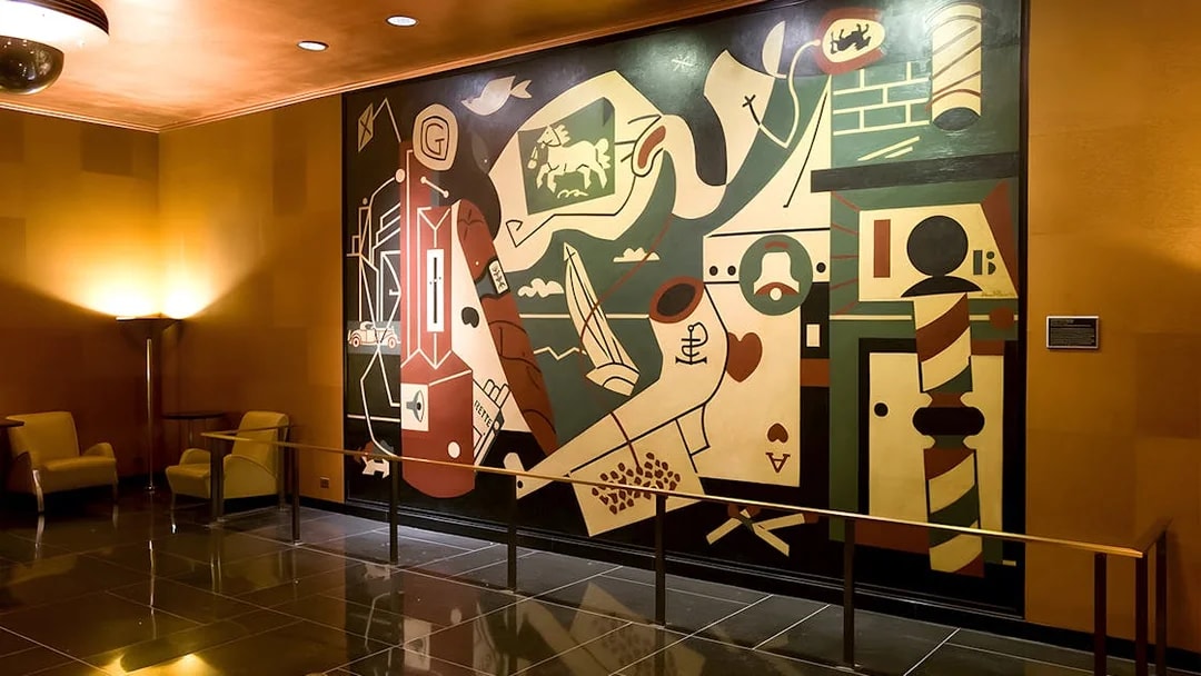 Art deco mural inside Radio City Music Hall during guided tour.