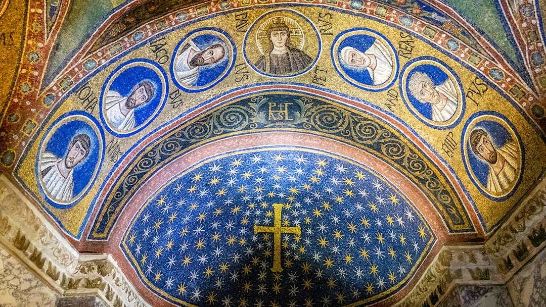 Ravenna mosaic depicting religious figures and a starry sky in a historic monument.