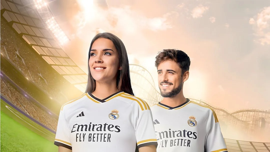 Real Madrid fans in team jerseys at a stadium, promoting World Tickets.