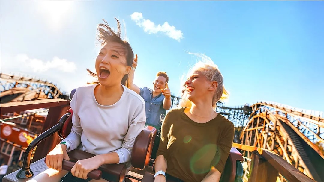 People enjoying a roller coaster ride at Real Madrid World, Dubai.
