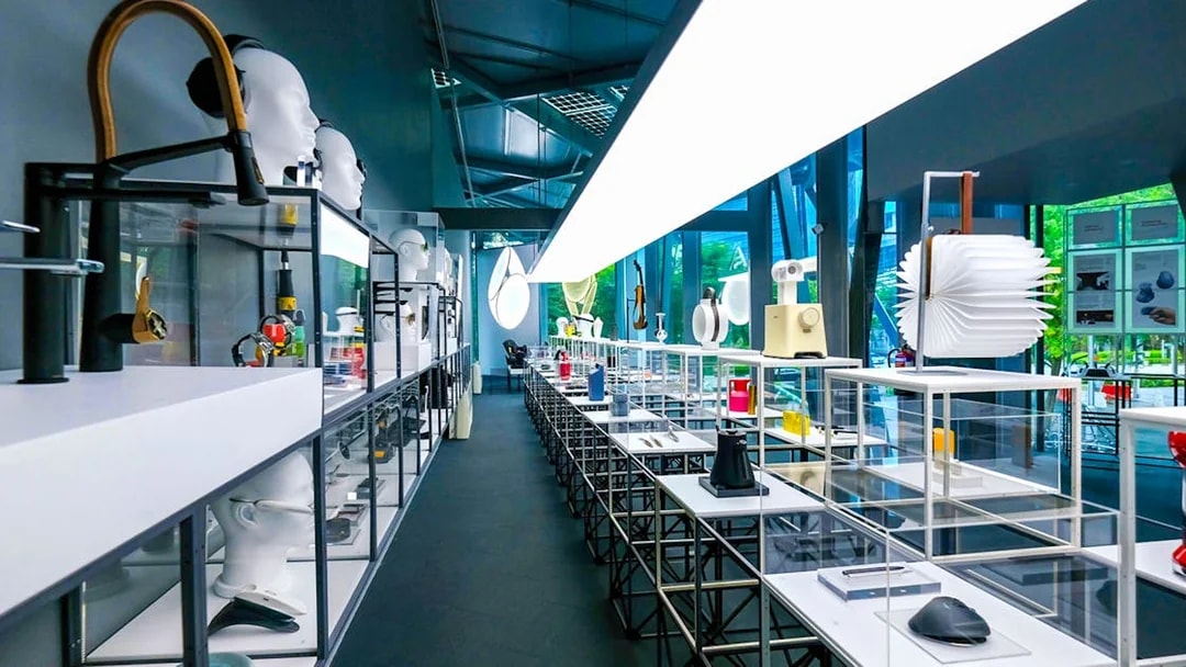 Exhibit displays at Red Dot Design Museum Singapore with modern design objects.