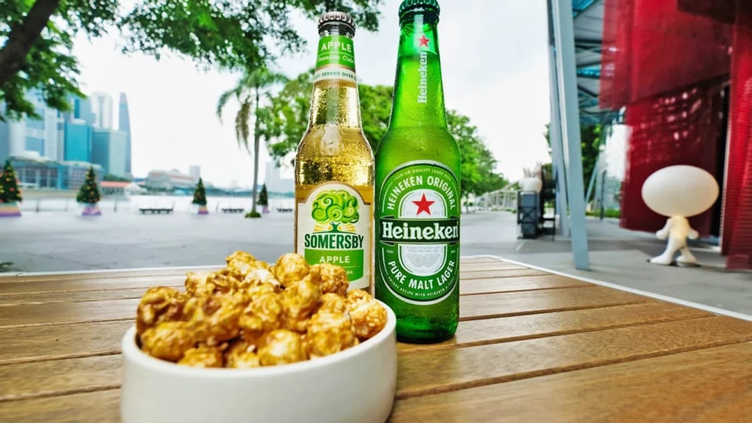 Bottles of cider and beer with caramel popcorn at Red Dot Design Museum, Singapore.