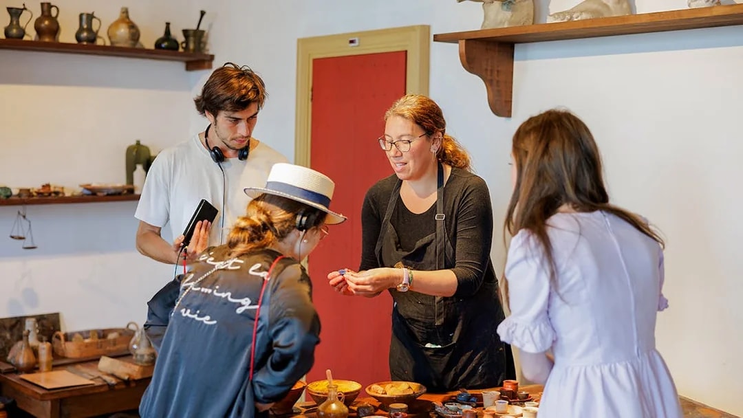 Guests engaging with a guide inside the Rembrandt House Museum, Amsterdam.