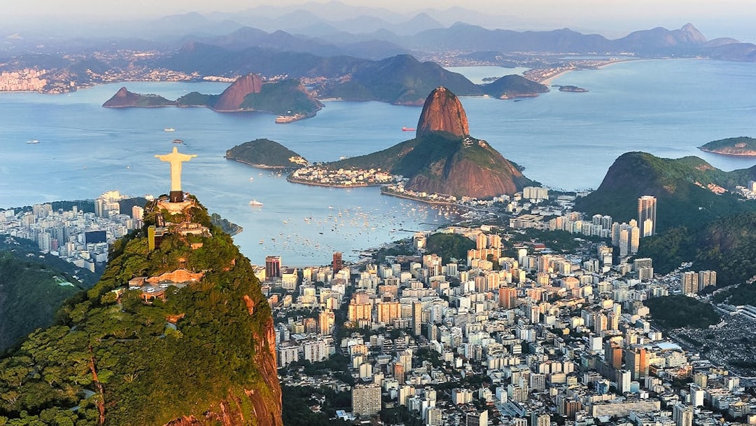 Aerial view of Christ the Redeemer, Sugarloaf Mountain, and Guanabara Bay in Rio de Janeiro.