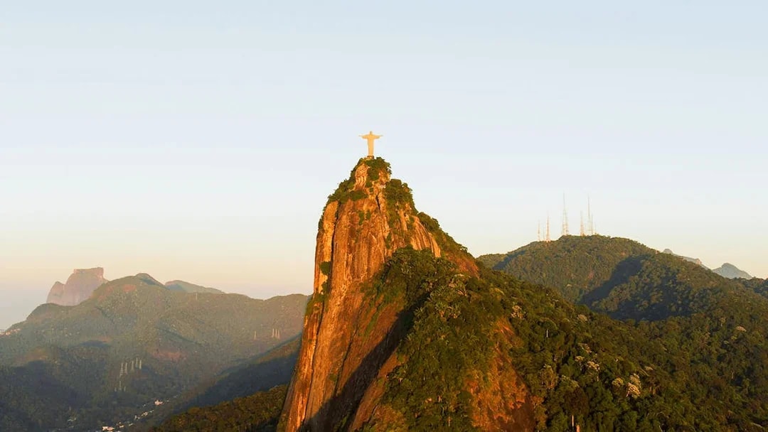 Christ the Redeemer statue atop Corcovado Mountain viewed from Sugarloaf Mountain, Rio de Janeiro.